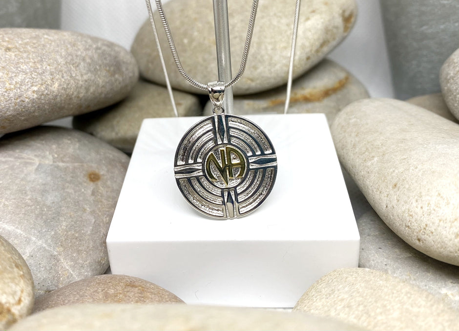 Original logo NA Pendant .925 sterling silver with 18k gold plated NA in center image 0