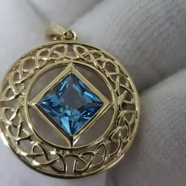 14 K Gold Blue Topaz NA Service Symbol Pendant image 0