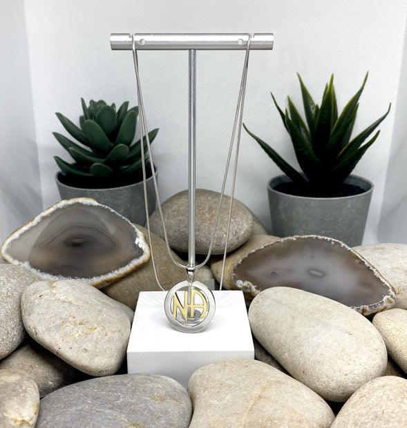 NA Pendant .925 sterling silver with 18k gold plated NA in center image 1