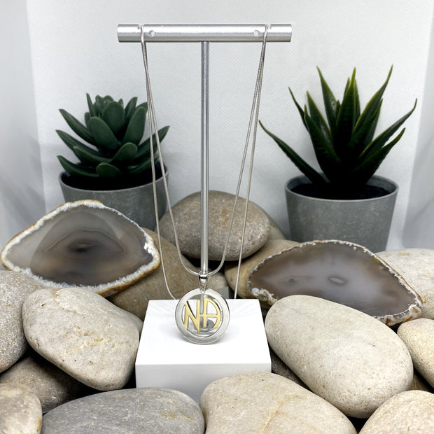 NA Pendant .925 sterling silver with 18k gold plated NA in center image 1